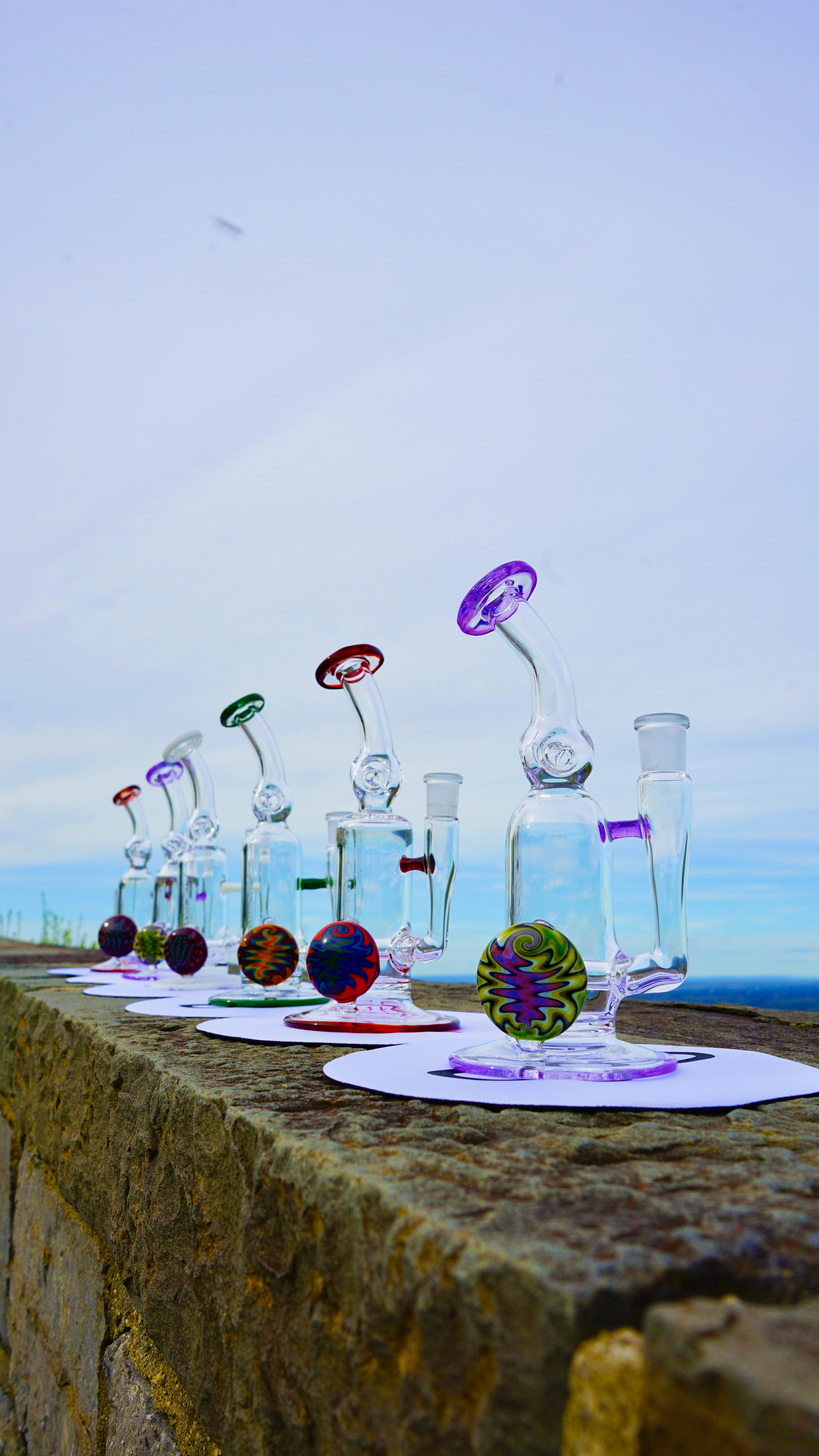 Colorful glassware displayed outdoors.